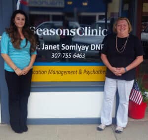 CLIMB graduate Jamie (left) and Dr. Janet Somlyay (right) in front of the Seasons Clinic in Laramie.